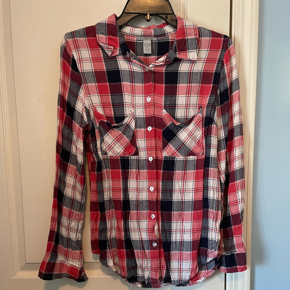 Red, white, and blue plaid button up top.